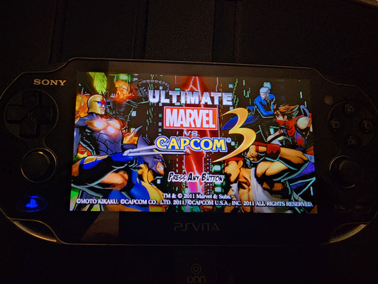 Used PS Vita 1001 – OLED Model | Includes Case, Memory Card & Ultimate Marvel vs. Capcom 3